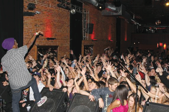 Rapper XV performs to an enthusiastic crowd at the University of Illinois last year. Photo via XV.