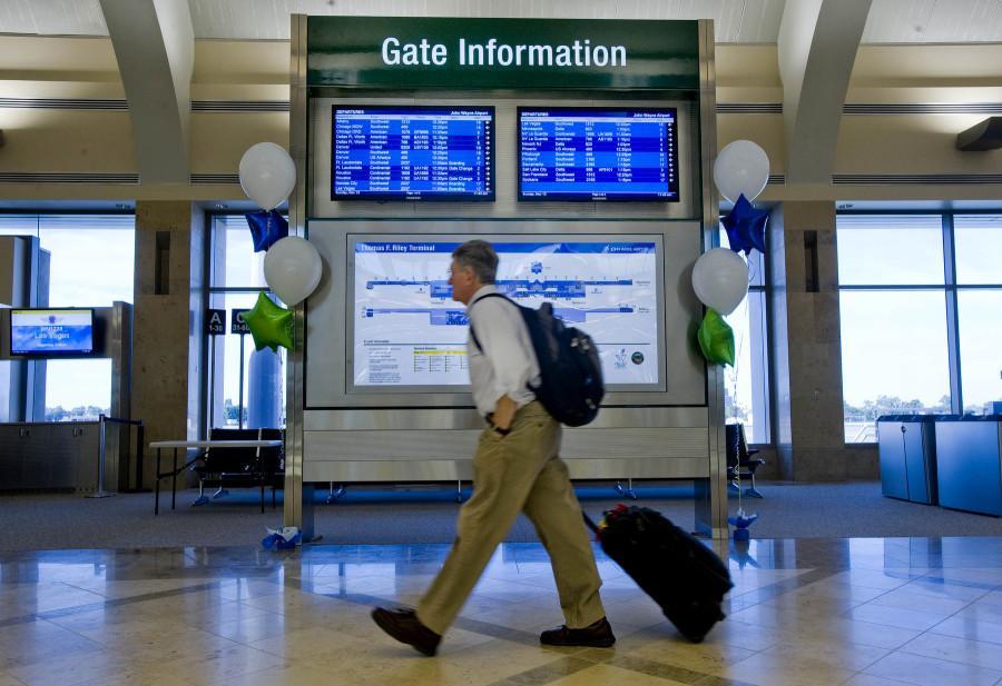 Frontier airlines will cut 120 in Milwaukee to help keep the airline out of financial straits (AP Photo/Orange County Register, Michael Goulding)