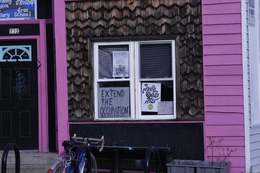 A house sits with protesting signs still in the window. Photo by Amanda Frank/amanda.frank@marquette.edu