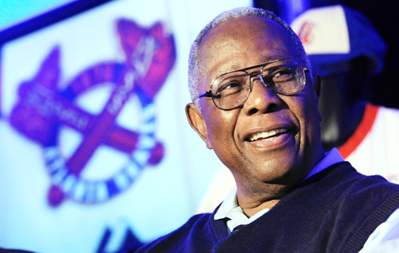 Atlanta Braves Hank Aaron attends a news conference to unveil the clubs new alternative home uniform, Monday, Feb. 6, 2012, in Atlanta. The new uniform will feature a patch bearing the image at left, and pays homage to the teams past, reflecting more of the look of the 1966 team when Aaron played. (AP Photo/John Amis)