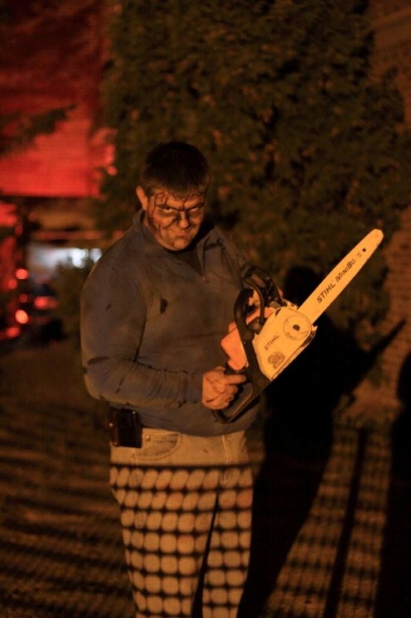 A chainsaw-wielding madman is just one of the creepy sights at Oconomowocs Haunted High. Photo courtesy of Tamara Hauck. 