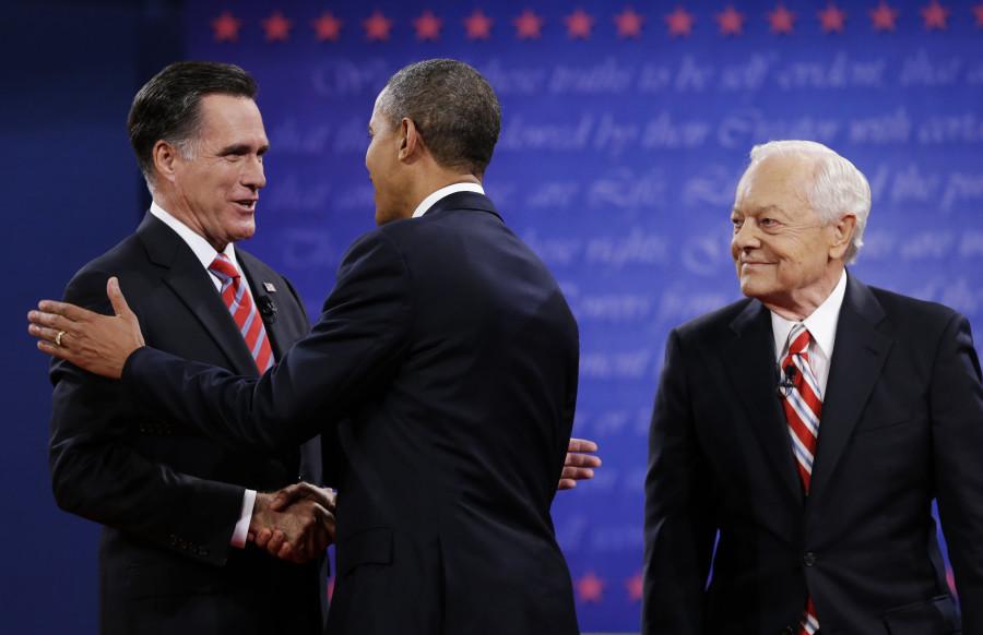 Moderator Bob Schieffer, right, watches as President Barack Obama, center, shakes hands with Republican presidential nominee Mitt Romney during the third presidential debate at Lynn University, Monday, Oct. 22, 2012, in Boca Raton, Fla. (AP Photo/Eric Gay)