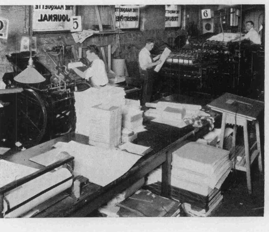 Marquette Tribune staff members prepare the paper for printing in the basement of Johnston Hall in 1933. Photo via Raynor Memorial Libraries Archives
