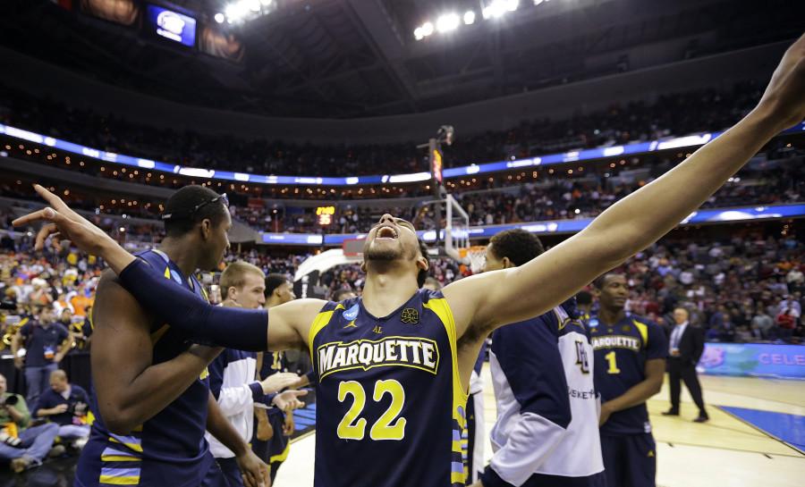 Marquette guard Trent Lockett (22) celebrates their 71-61 win over Miami in an East Regional semifinal in the NCAA college basketball tournament, Thursday, March 28, 2013, in Washington. (AP Photo/Alex Brandon)