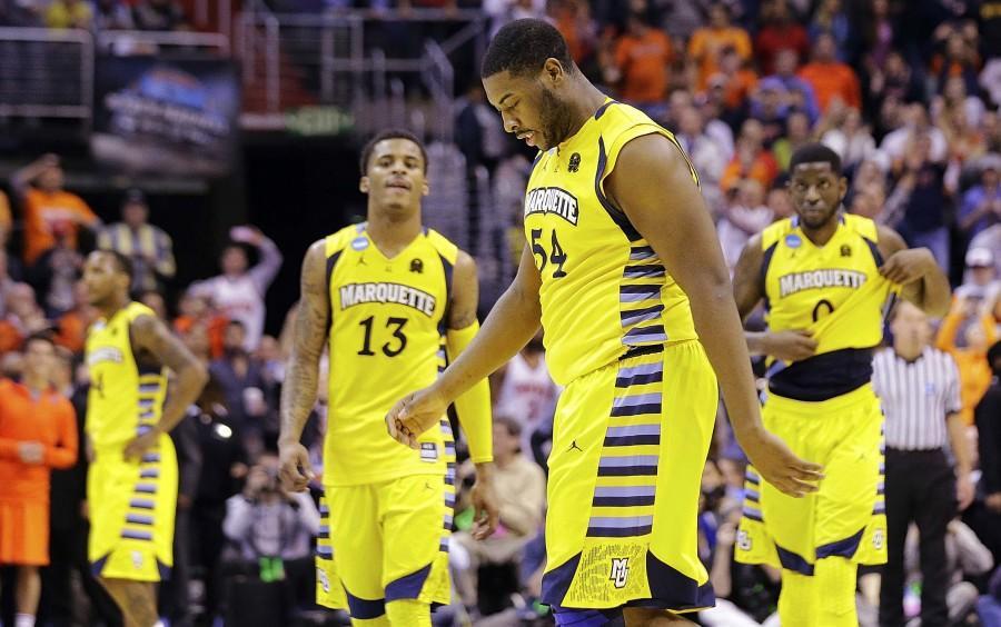 Marquette forward Davante Gardner (54), guard Vander Blue (13) and forward Jamil Wilson (0) walk off the court after their 55-39 loss to Syracuse in the East Regional final of the NCAA mens college basketball tournament, Saturday, March 30, 2013, in Washington. (AP Photo/Alex Brandon)