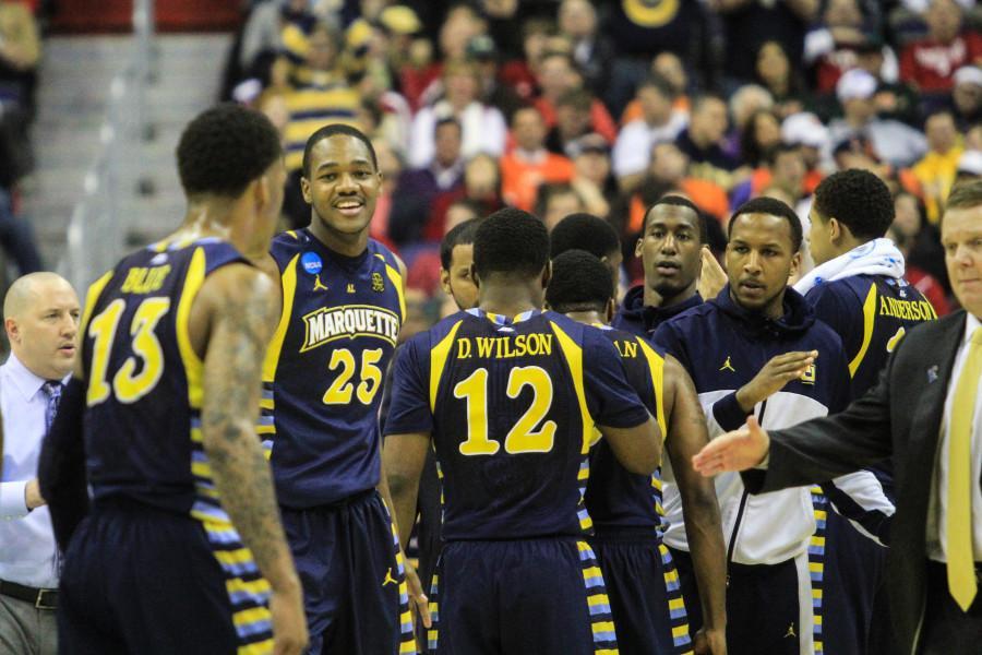 The men’s basketball team celebrate after defeating Miami in the 2013 NCAA Tournament. Including two graduating seniors, six players will not return to the team next season. Photo by Danny Alfonzo/ daniel.alfonzo@marquette.edu