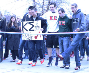 Members of the Kappa Sigma fraternity Carlos Soria, Ryan Woo, Matt McCarthy, Dennis Aloia and Alex Busbee take part in Alpha Chi Omega's "Walk A Mile in Her Shoes" event, which aims to raise awareness for sexual violence.