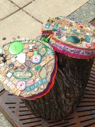 Evelyn Patricia Terry's bedazzled tree stumps use art to spread inspirational messages near bus stops. Photo courtesy of Linda Pollock.  