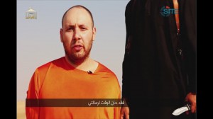 This image made from video posted on the Internet by Islamic State militants and provided by the SITE Intelligence Group, a U.S. terrorism watchdog, on Tuesday, Sept. 2, 2014, purports to show journalist Steven Sotloff before he was beheaded.