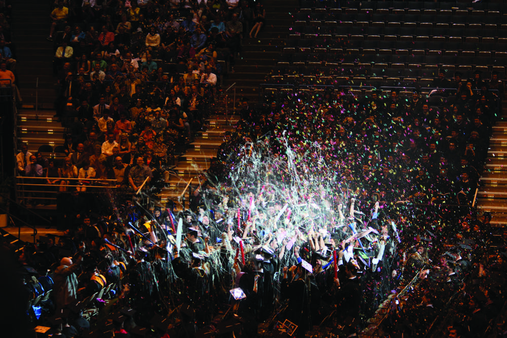 Marquette's Class of 2013 graduating from the School of Dentistry celebrate after receiving their diplomas. Photo by Rebecca Rebholz / rebecca.rebholz@marquette.edu