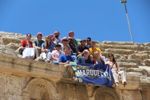 Students pose with a Marquette banner while studying in Jordan. Photo courtesy of the Office of International Education.