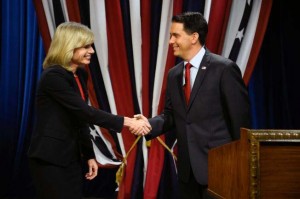 Wisconsin Republican Governor Scott Walker, right, shakes hands with Democratic challenger Mary Burke before a televised debate Friday, Oct. 17, 2014, at the WMVS-TV studio in Milwaukee. Photo by Benny Sieu / Associated Press.