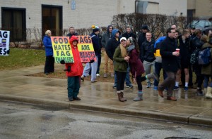 A Westboro Baptist Church picketer is met by two counter-picketing students. Photo by Matthew Serafin/matthew.serafin@marquette.edu