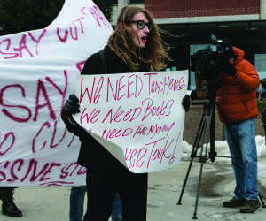 A student at the Universty of Wisconsin-Milwaukee campus demonstrates against Gov. Scott Walker's proposed budget cuts. Photo by Dan Barrett / Special to the Wire.