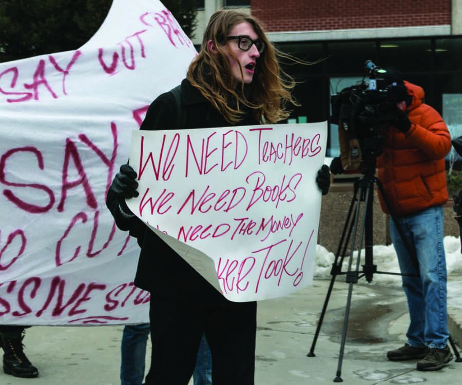 A student at the Universty of Wisconsin-Milwaukee campus demonstrates against Gov. Scott Walkers proposed budget cuts. Photo by Dan Barrett / Special to the Wire.