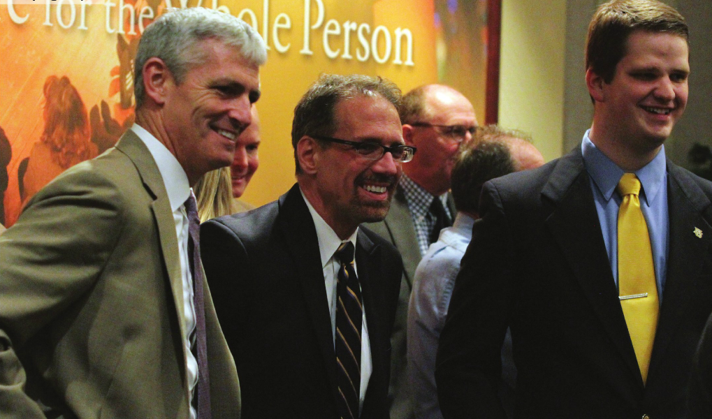 Daniel Myers (center) being introduced by University President Michael Lovell (left) and MUSG President Kyle Whelton (right) in the Alumni Memorial Union. Photo by Valeria Cardenas / valeria.cardenas@marquette.edu