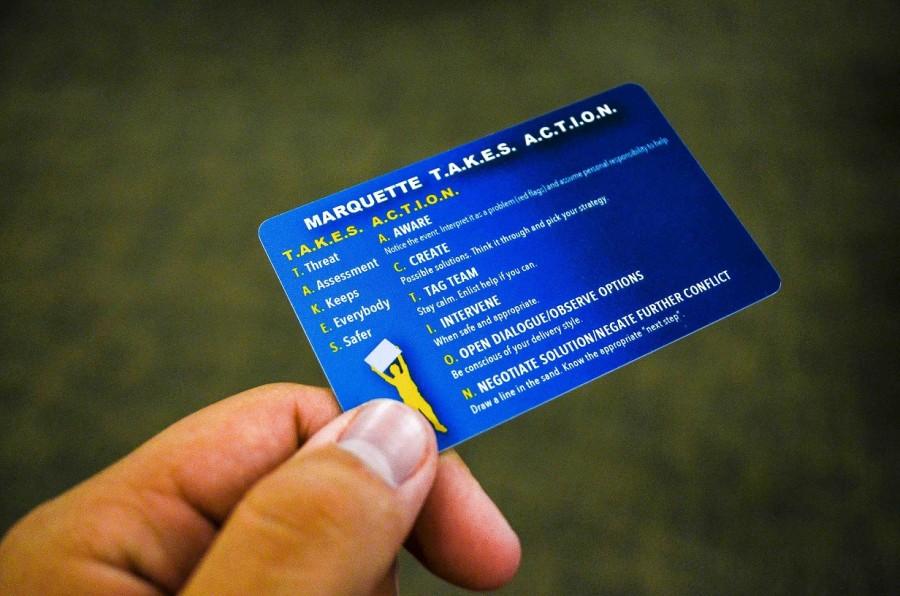 Students at the training sessions receive plastic, wallet-sized cards with intervention strategies and engagement phrases on them. Photo by Matthew Serafin /matthew.serafin@marquette.edu