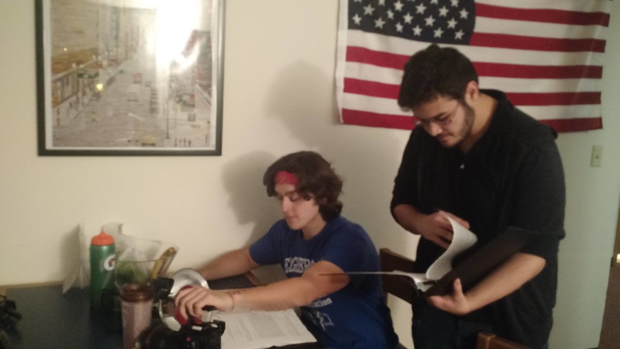 Geroge Bicknell and Brian Mohsenian review their script before shooting the mystery drama web miniseries