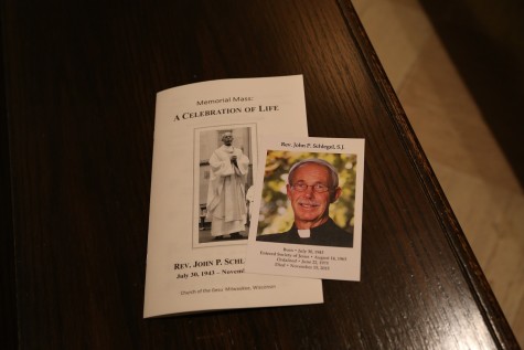 Program and prayer card from the memorial Mass. Photo by Yue Yin/ yue.yin@marquette.edu