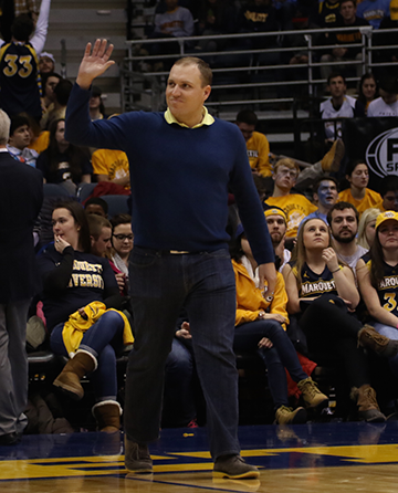 Mike Van Sickle waves to the crowd at the BMO Harris Bradley Center on Saturday night at the Marquette Mens Basketball game. 