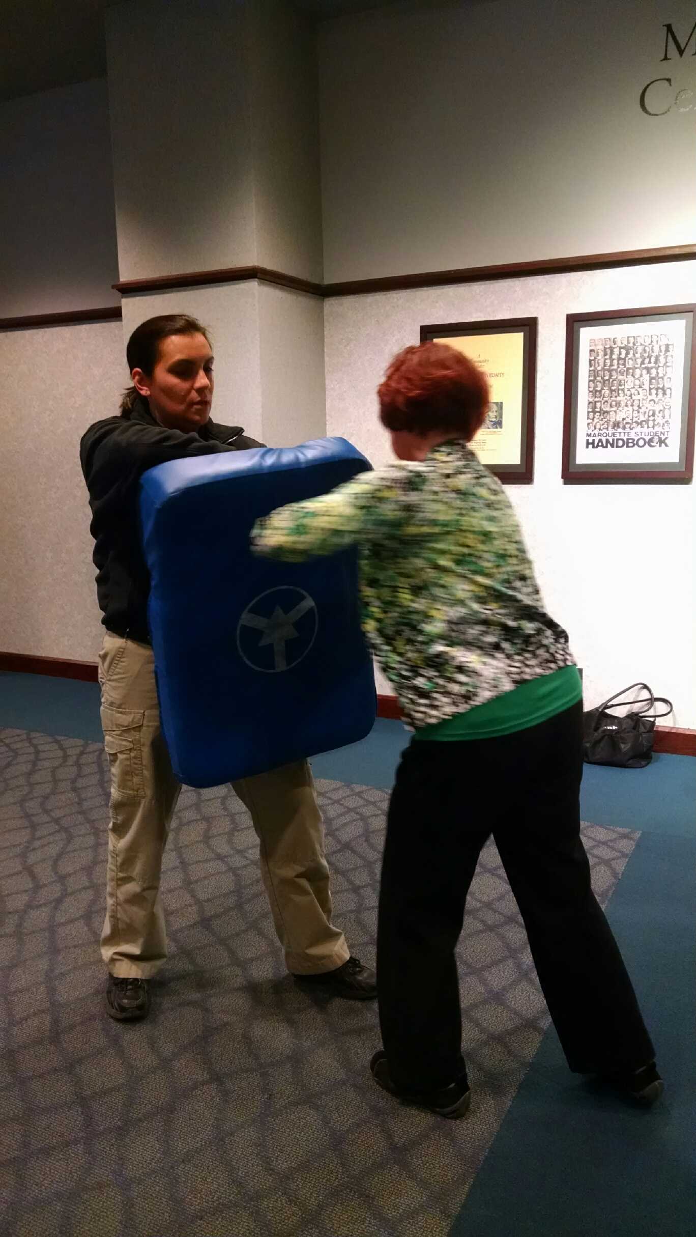 Victoria Fitzgerald (right) was one of three participants of this month's self-defense class, which are led by Capt. Ruth Peterson (left). Photo by Alex Groth/alexandria.groth@marquette.edu