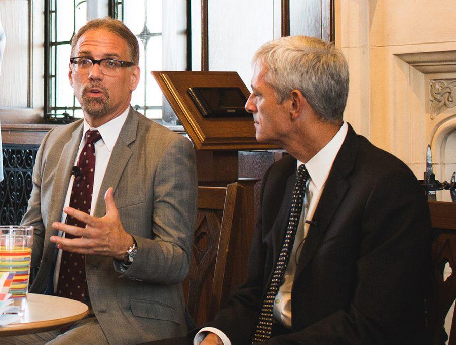 Marquette University President Lovell (right) visited today’s Academic Senate meeting to discuss changes in the provost position now that Daniel Myers (left) is no longer in that role.