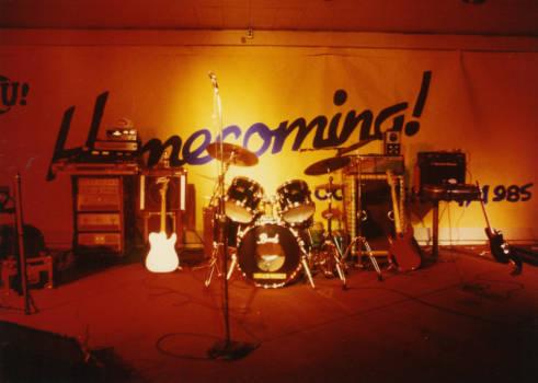 Instruments and other equipment were scattered across the stage in preparation for a performance. 