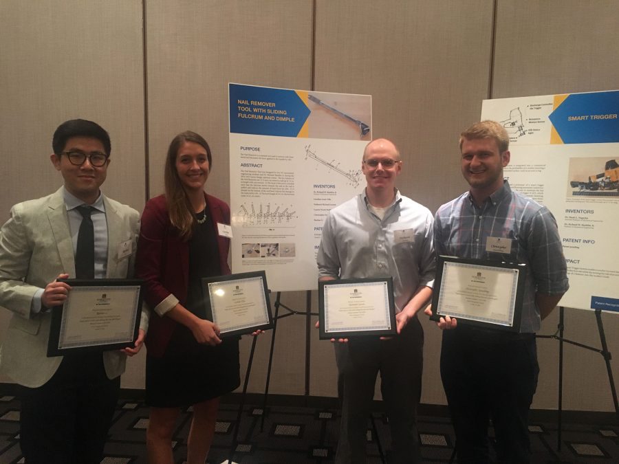 Engineering students Ruohao Li, Caroline Villa, Nathaniel Larson and Christopher Spaulding receive their patent recognition award.