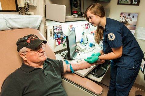 Kateri Shampo, a junior, draws the blood patient Raimandol Terrara.