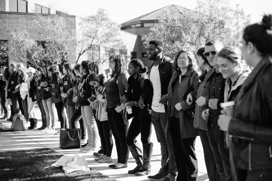 The+Westowne+Square+gathering+of+many+students+and+faculty+standing+and+joining+hands+was+important+for+this+campus+community+because+it+was+a+physical+and+visual+representation+of+the+unity+we+must+foster.