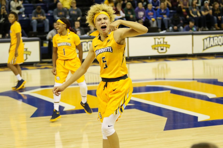 Natisha Hiedeman celebrates one of her 5 three-pointers in Marquettes 75-63 victory over Arizona State. 