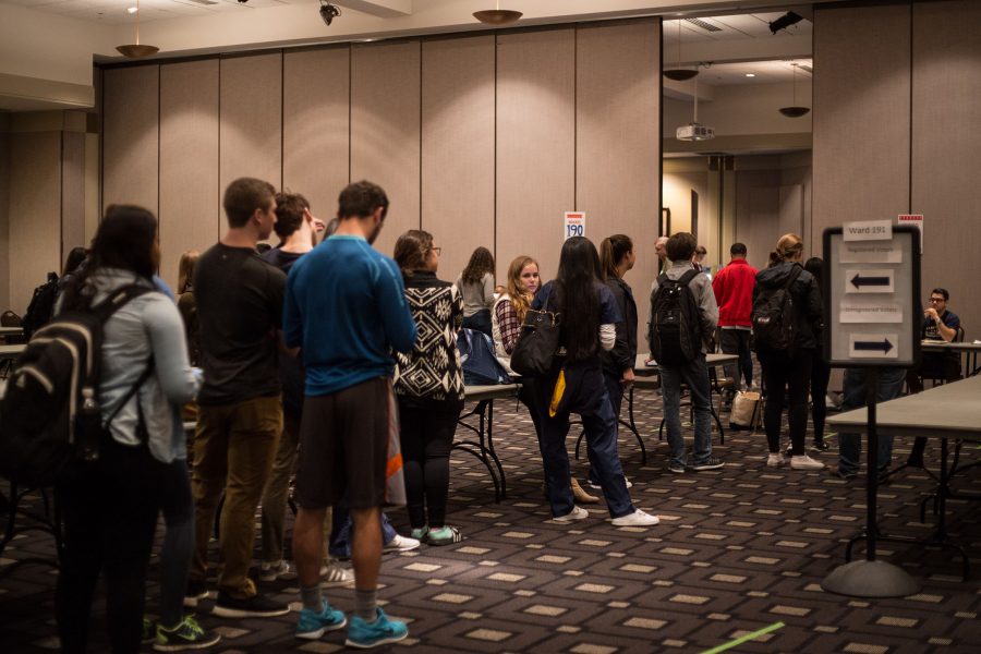 Students wait in line at the Alumni Memorial Union to vote. 