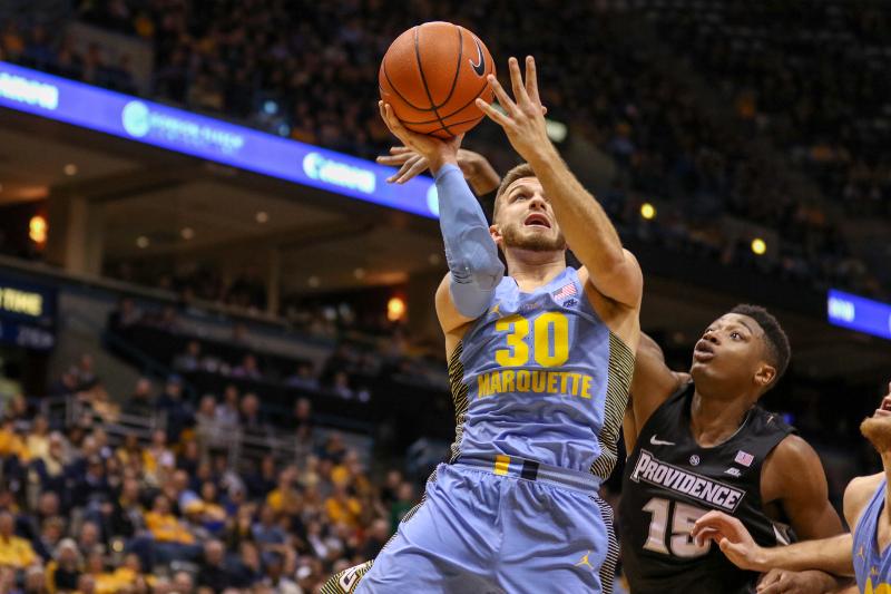 Andrew Rowsey hit an unlikely 3-point shot while getting fouled to keep Marquette in the game late.