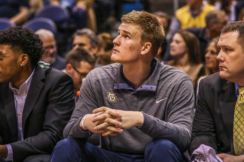 Harry Froling sat on the bench during Marquettes game against Seton Hall Wednesday.