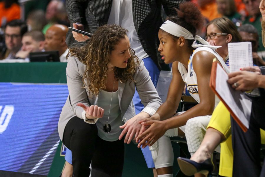 Head coach Carolyn Kieger (left) talks with guard Amani Wilborn (right). Kieger has a 48-46 record in three years at the helm.