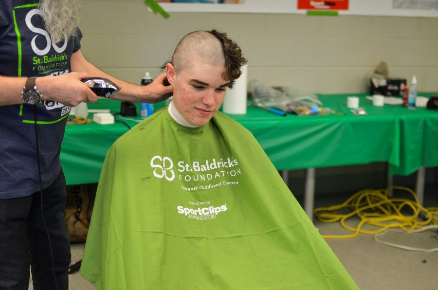 Freshman, Brendan OGrady gets his head shaved at an annual fundraiser to help spread awareness for St. Baldricks Day. Photo via Matthew Serafin/ matthew.serafin@marquette.edu