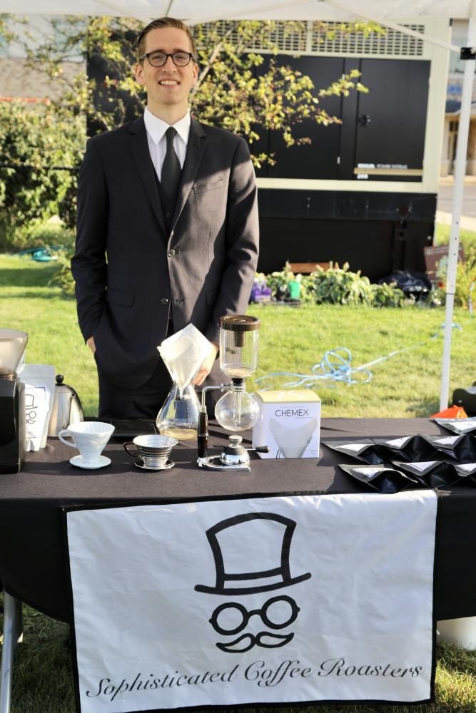 Brendan Nemeth at the Near West Side Farmers market booth for his company, Sophisticated Coffee Roasters.