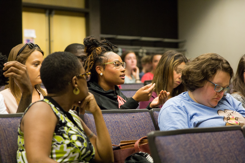 Lauren Gilbert, a second year graduate student in the student affairs in higher education program, asking questions at the Race After Charlottesville.