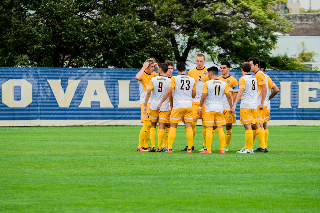 Marquette men's soccer starters gather around before their match against Providence. The Golden Eagles have yet to play the same starting XI this season due to injuries.