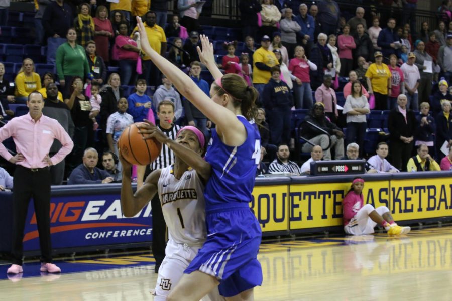 Junior Danielle King goes up for a shot under duress from the Creighton defense.