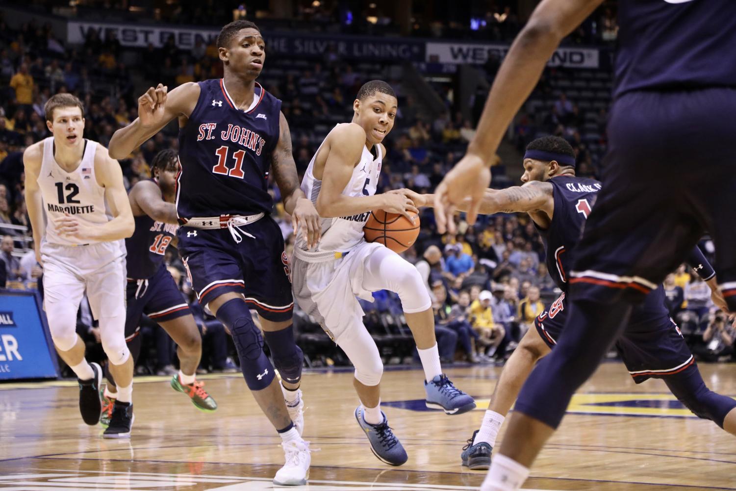 Freshman guard Greg Elliott scored 11 points in place of injured guard Markus Howard. Marquette went on to win 85-73 over St. John's