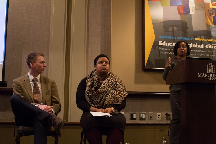 Conor Kelly, an assistant professor of theology, and Monique Liston, an adjunct instructor of Gender and Sexualities Studies participate in a panel discussion. 