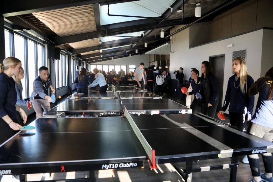 Womens lacrosse carried over their staff games of pingpong from the office to Evolution: Milwaukee.