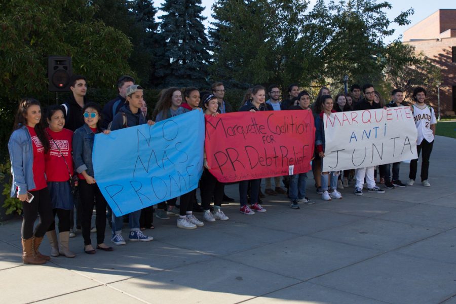 Students gather outside of the Alumni Memorial Union to pass a petition to support the Marquette Puerto Rican Coalition Debt relief. 
