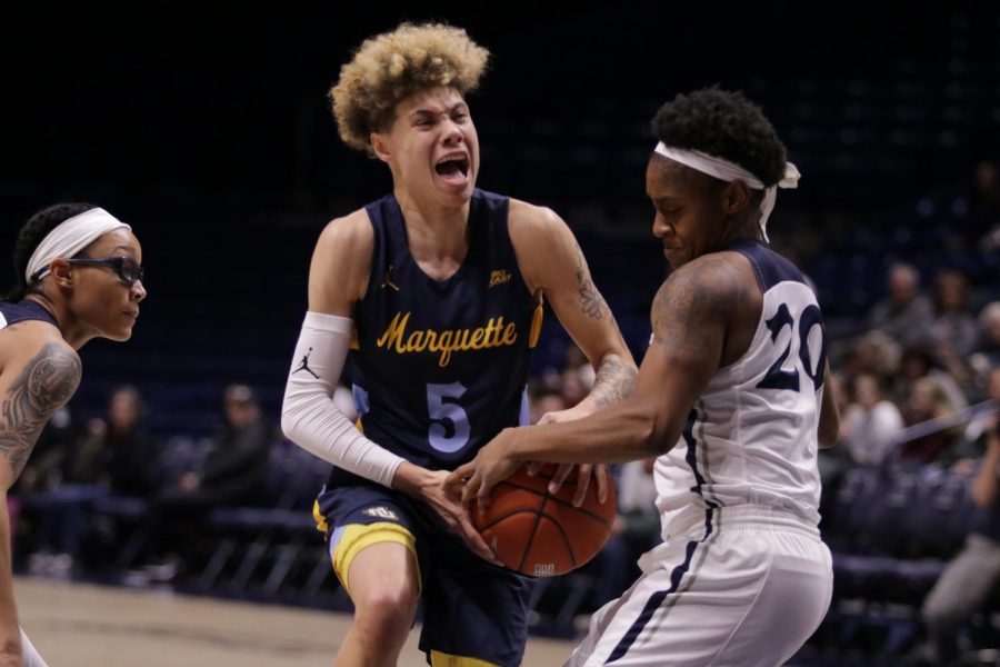 Early 19-0 run helps Marquette ease past Xavier with historic milestone