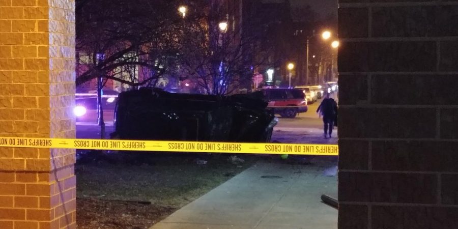 A car appeared to be flipped on its side after crashing near the Alumni Memorial Union. 