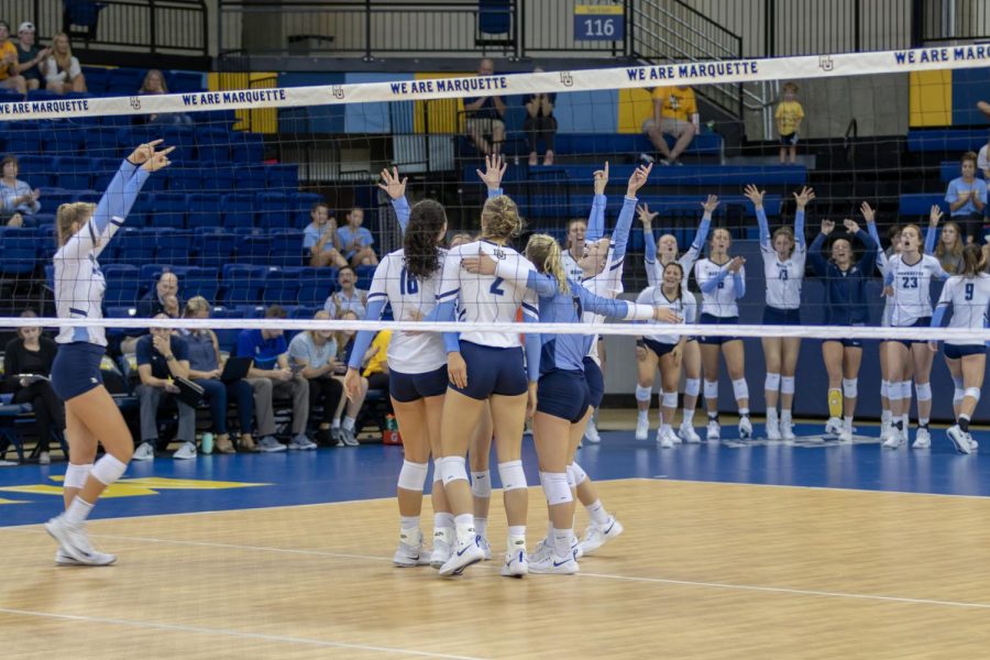 Marquette celebrates a point in its win against Syracuse Sept. 7.