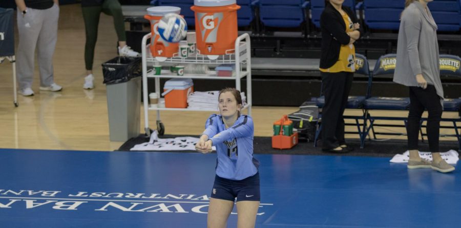 Katie+Schoessow+goes+to+hit+a+ball+during+warmups+before+Marquette+sweep+over+Saint+Louis+University+Saturday+morning.+