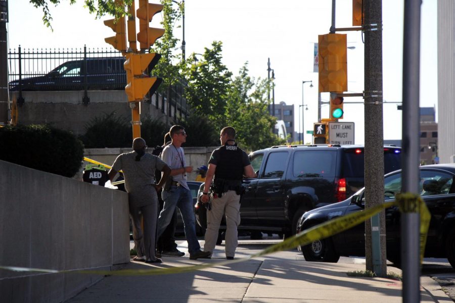 Police work to gather information on the scene near 9th and Wells streets after Tuesdays shooting.