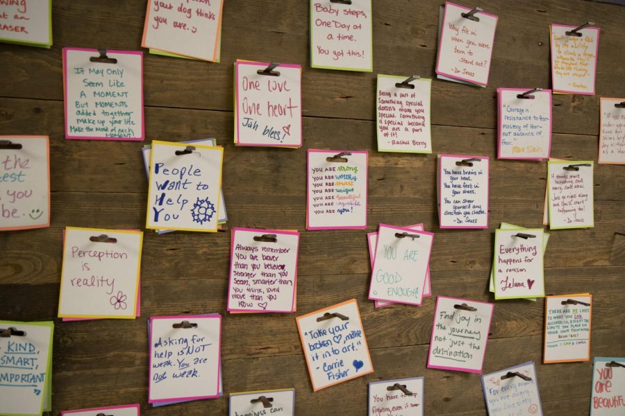 A wall of notes promote motivational sayings to keep students going. 